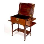 A late 18th Century mahogany campaign table, the top with writing slope and leather lined interior,