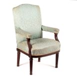 An upholstered armchair with acanthus carved arms,