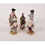 A pair of Sitzendorf monkey band figures of a drummer and French horn player, the tallest 11cm high,