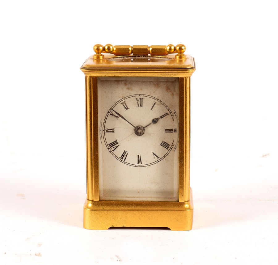 A small carriage clock in a gilt brass case,