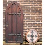 A late Victorian Gothic arch-top door with steel hinges stamped Collinger & Lambert,