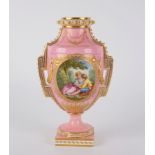 A Coalbrookdale pink ground Sèvres style vase, painted a gallant and companion, blue conjoined,