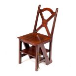 A late 19th Century mahogany metamorphic chair, the x-shaped back with oval cartouche,