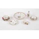 A Meissen strainer painted bouquets and sprigs, on shell feet, a coffee cup and saucer similar,