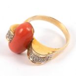 A coral and diamond dress ring of modern design, set in 14k yellow gold,
