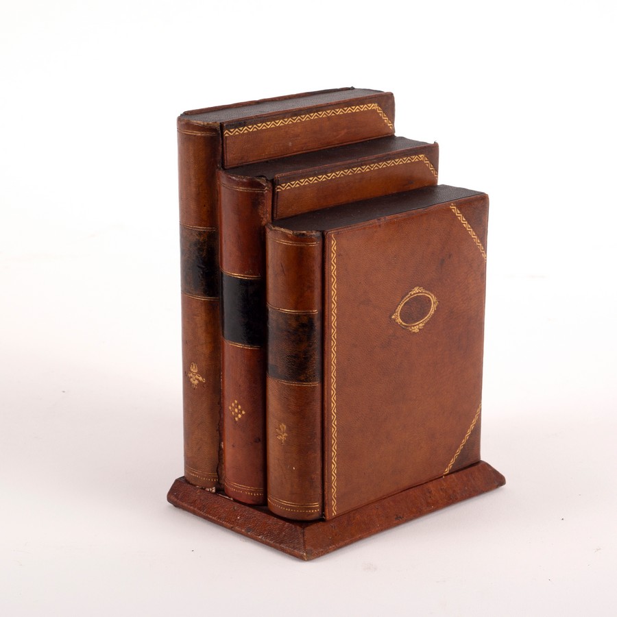 A 19th Century book box containing three secret drawers,