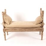 A rectangular window seat with slatted ends on turned legs with distressed painted decoration,