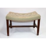A dressing table stool with needlework seat on square chamfer legs,