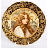 A Vienna style plate painted a maiden amongst sunflowers, signed Wagner, titled 'Herbst' to reverse,