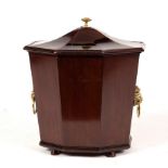 A Regency style octagonal vase-shaped wine cooler and cover, lion mask handles to the sides,