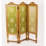 A gilt wood three-panel, two-fold screen on umbrella type supports, 114.