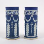 A pair of Wedgwood blue Jasperware cylindrical spill vases, first half of the 19th Century,