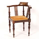 A child's Edwardian mahogany corner chair,