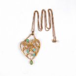 An Edwardian heart-shaped pendant of openwork form, set with turquoise and pearls in 9ct gold,