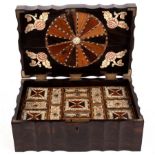 A 19th Century amboyna work box of serpentine outline, the interior fitted two trays,