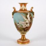 A Royal Worcester oviform vase decorated with swans on a blue ground enriched in gilding,