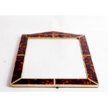 An Edwardian wall mirror, the tortoiseshell frame with triangular pediment,