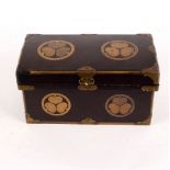 A 19th Century brown lacquered box painted gilded trefoil foliate circles and with embossed gilded