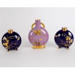 A pair of Minton blue ground pilgrim flasks with three-colour gilding and a Worcester flask similar