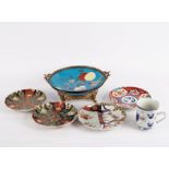 Four Imari plates with serrated borders,