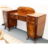 A William IV mahogany pedestal sideboard with reeded pillars to the canted sides,