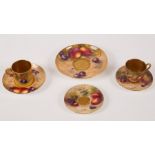 A group of Royal Worcester fruit painted tea ware, comprising a demitasse and two saucers,