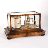 A barograph in an oak case, 36.