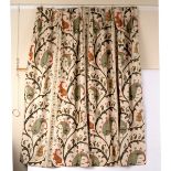 Two pairs of woven curtains, cream ground with foliate designs in green,
