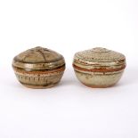 Richard Batterham (born 1936), two circular lidded stoneware boxes, green ash glaze,