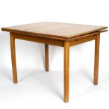 Gordon Russell, British mid 20th Century, a light oak extending dining table,