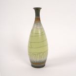 David White (1934-2011), a slender porcelain vase, pale green crackled glaze, impressed mark,