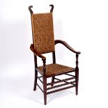 J S Henry, British late 19th/early 20th Century, an Arts & Crafts mahogany armchair,