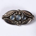 George Jensen, a silver and moonstone set brooch, numbered 156,