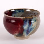 Isabelle Daucourt Mignon (born 1943), a stoneware bowl with mottled reds, blue and brown glazes,