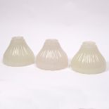 A set of three Jefferson moonstone shades, the opaque glass of ribbed design with scalloped edges,