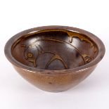 Manner of Svend Bayer, a glazed earthenware bowl with dripped design of a bird to interior, 17.