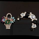 A costume jewellery brooch in the form of a basket containing flowers,