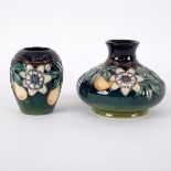 Moorcroft Pottery, a Passionfruit vase, of squat bulbous form, 10.5cm high and an ovoid vase, 9.