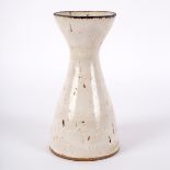 Lucie Rie (1902-1995), a stoneware vase with flaring rim, speckled white glaze,