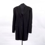 A Yohji Yamamoto long-line black button through jacket with slip pockets and revere collar