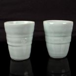Edmund de Waal (born 1964), two porcelain beakers, 1995, pale celadon glaze with delicate crackle,