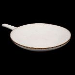 Lucie Rie (1902-1995), a stoneware skillet, oatmeal glaze with manganese rim, impressed seal, 25.