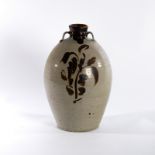 A stoneware bottle vase with twin lug handles to the neck,