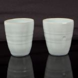 Edmund de Waal (born 1964), two porcelain beakers, 1995, pale celadon glaze with delicate crackle,