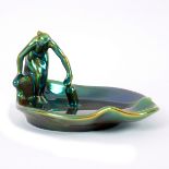 Zsolnay, an Art Nouveau dish, late 19th Century, modelled as a woman with a pail beside a lily pad,