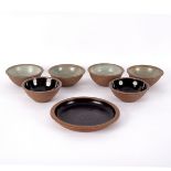 Studio Pottery, a set of four stoneware bowls, with ash glazed interior, each stamped RB England,