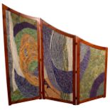 A decorative three-panel folding screen,