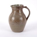 Ray Finch (1914-2012) for Winchcombe Pottery, a saltglaze ribbed jug with combed decoration,