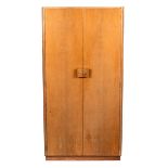 Gordon Russell, British 1940s, a Utility double wardrobe with shaped wood handles,