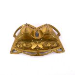 A brass inkwell in the Jugendstil style, embossed snowdrops and with flowerhead covers,